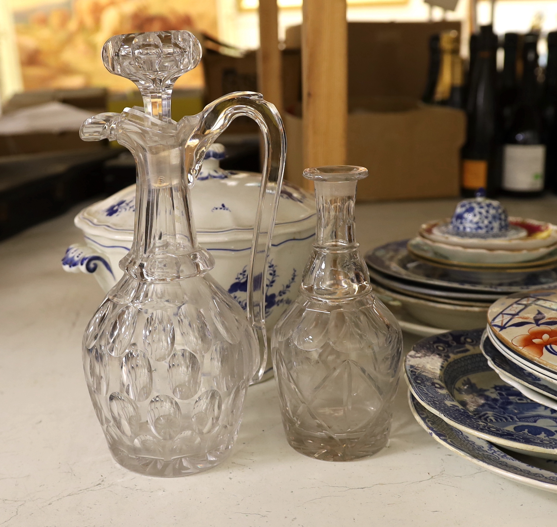 A quantity of assorted ceramics and glass including a group of 19 century blue and white pottery, a Victorian heavy cut glass decanter and stopper etc.